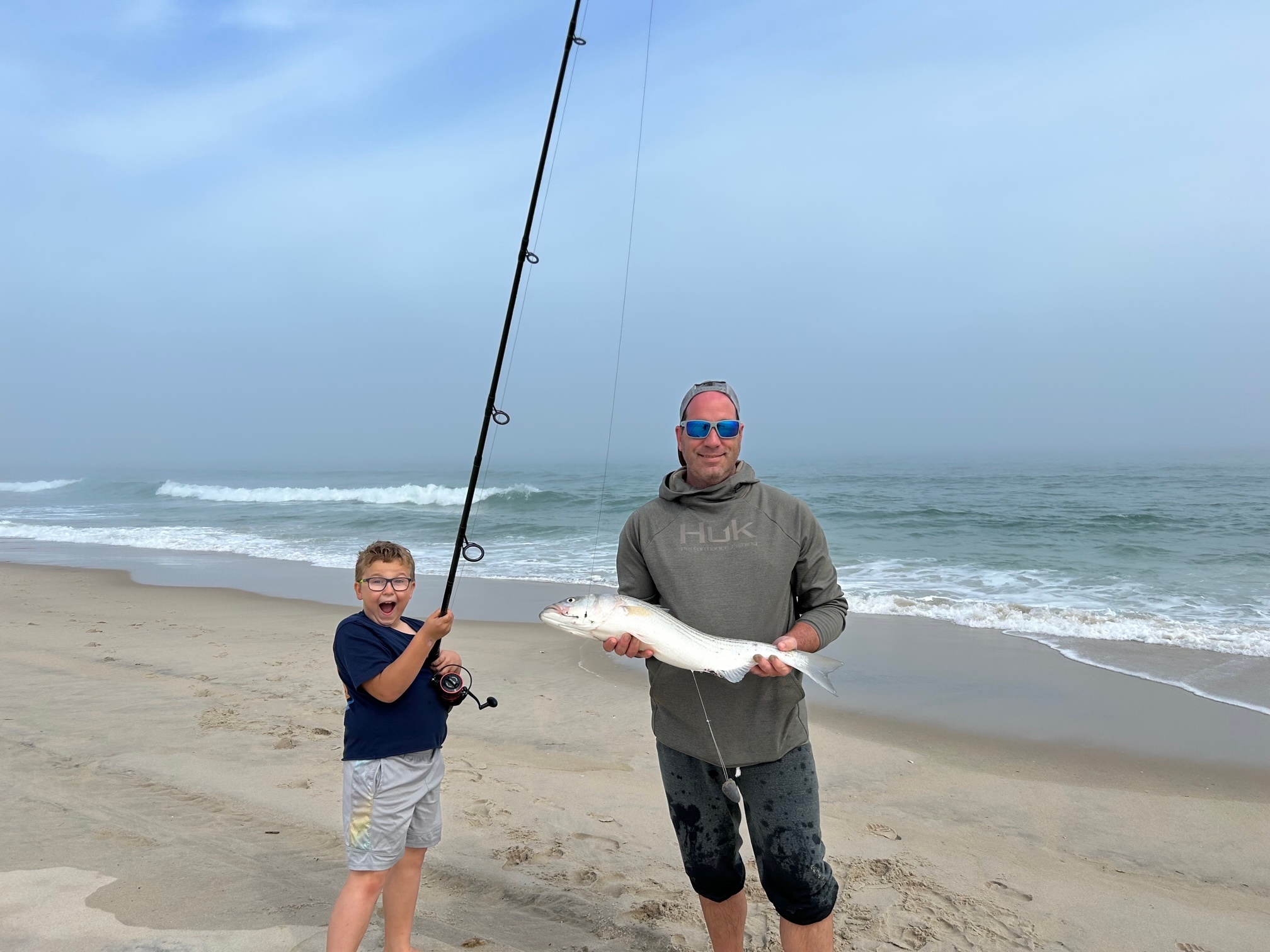 Bryan and Casey with their 30″ bass Jingles Bait and Tackle Beach